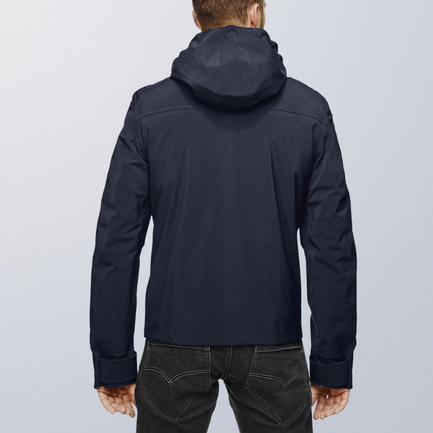 Blouson moto imperméable V4 bleu vue de dos, capuche intégrée et lignes sobres VEST PARIS