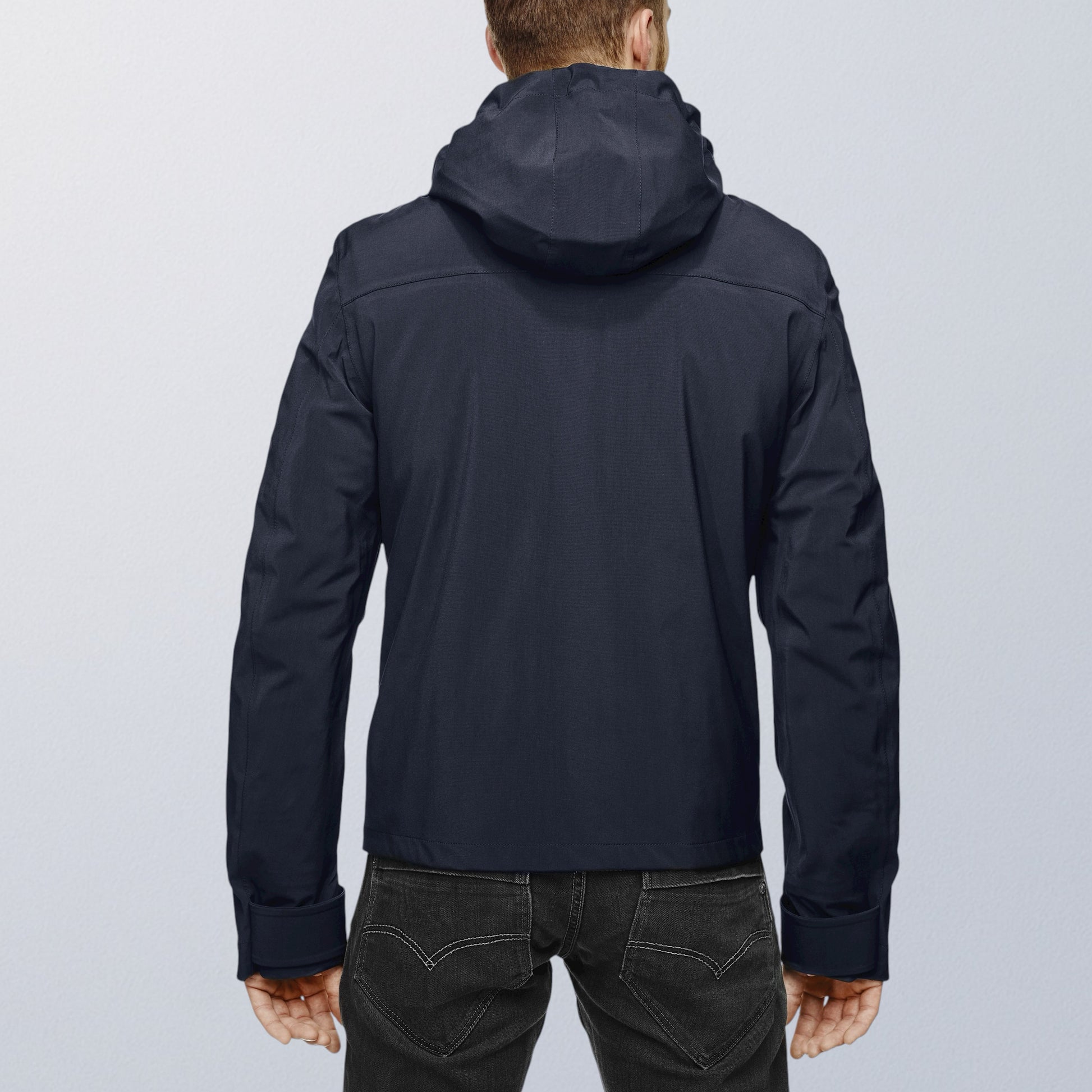 Blouson moto imperméable V4 bleu vue de dos, capuche intégrée et lignes sobres VEST PARIS